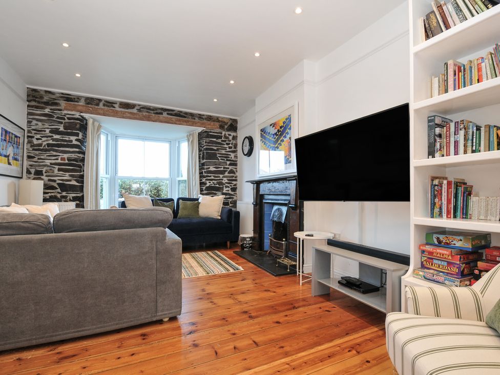 A living room with a sofa and television at 2 Glyddins 1910 in Rock