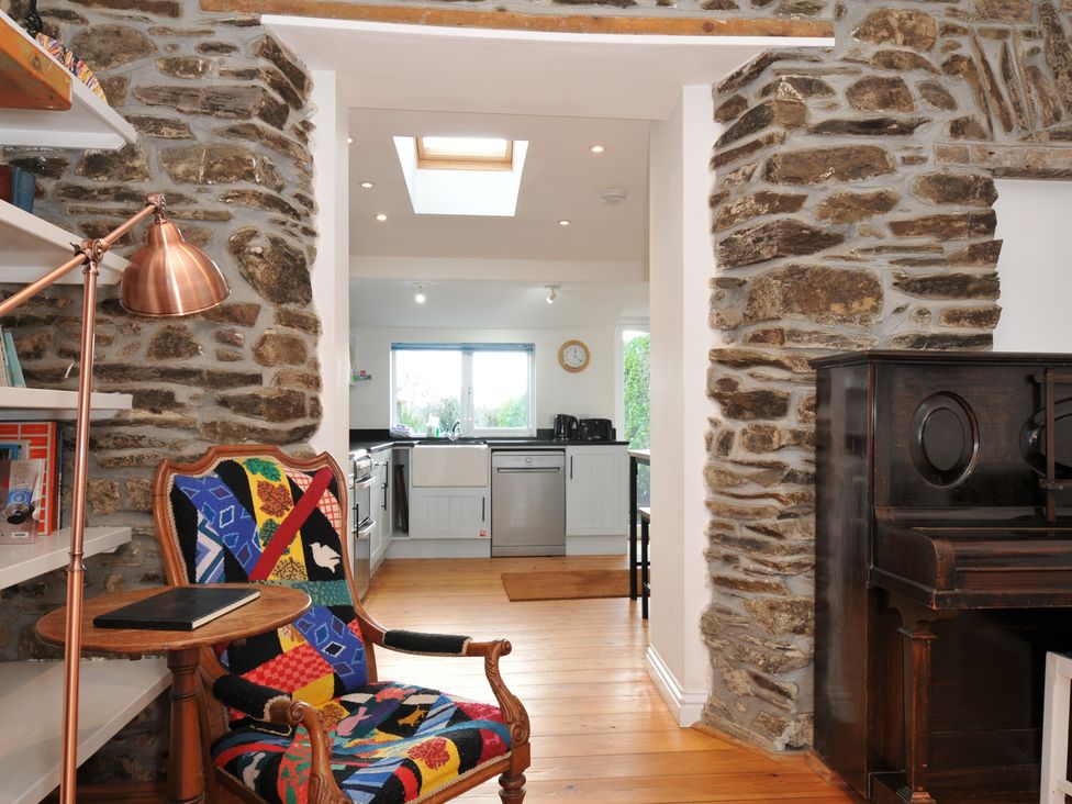 A living room with a view to the kitchen at 2 Glyddins 1910 Rock