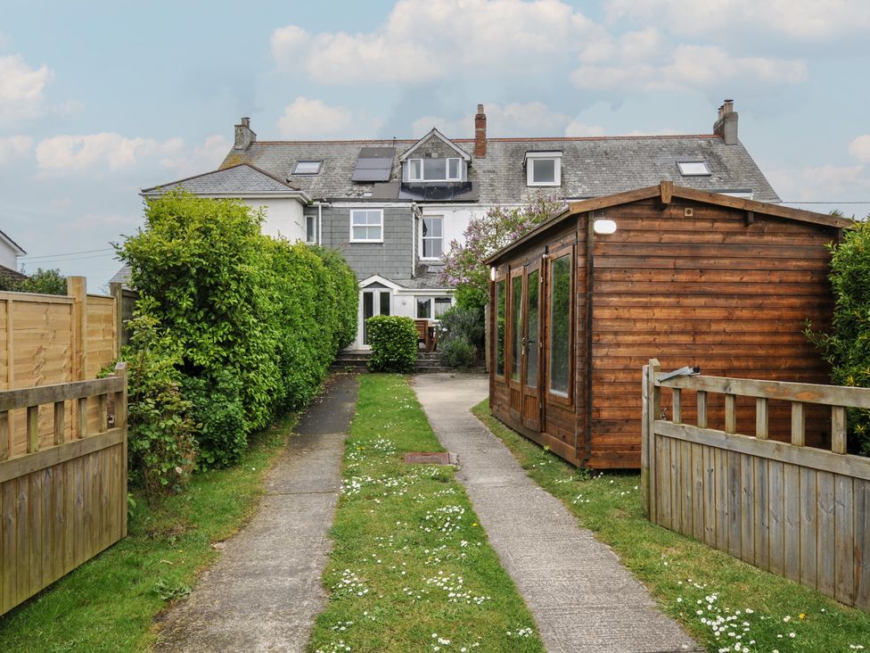 A garden with a pathway and shed at 2 Glyddins 1910 Rock