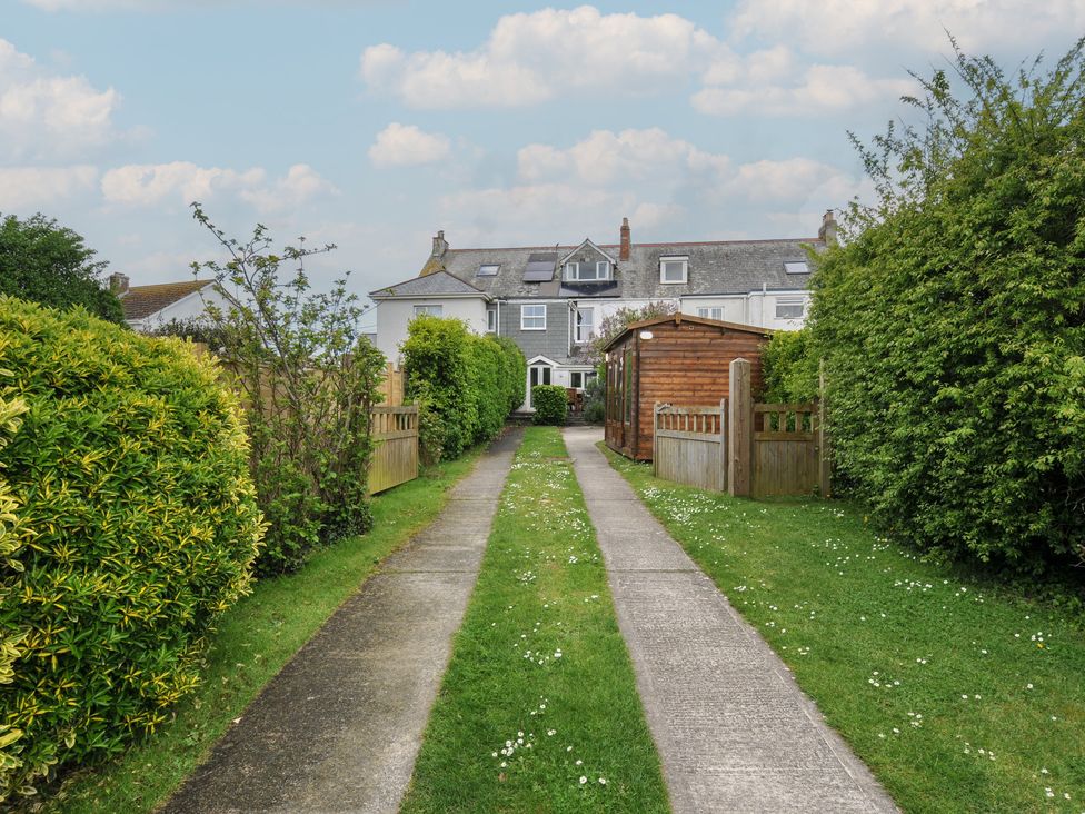 A pathway leading to a building with garden at 2 Glyddins 1910 in Rock