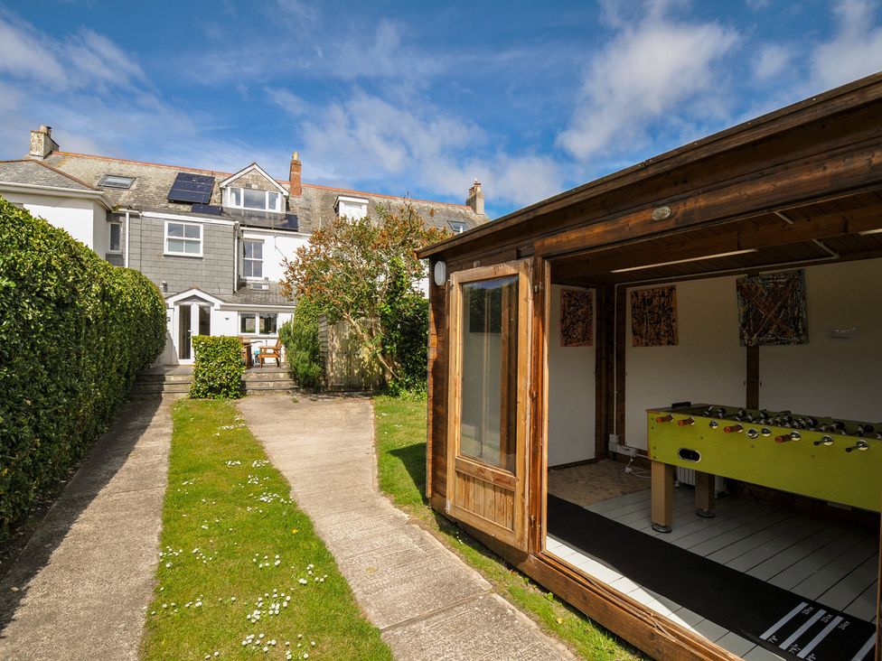 A garden with a wooden shed and pathway at 2 Glyddins 1910 in Rock