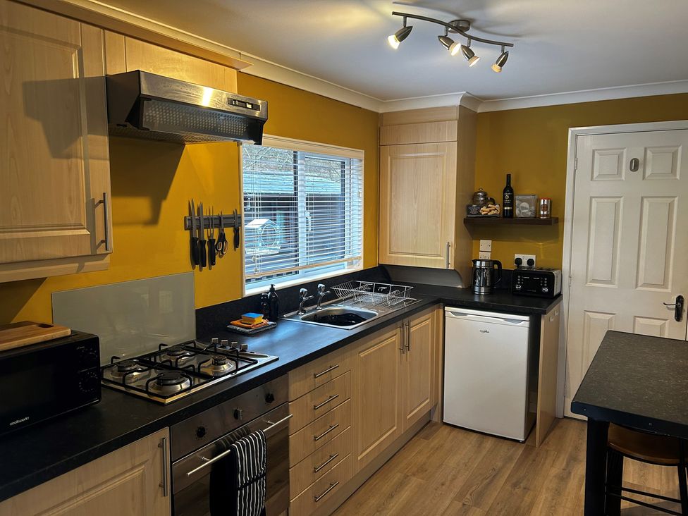 A kitchen with countertop and appliances at 22 Two Little Ducks, Lynton