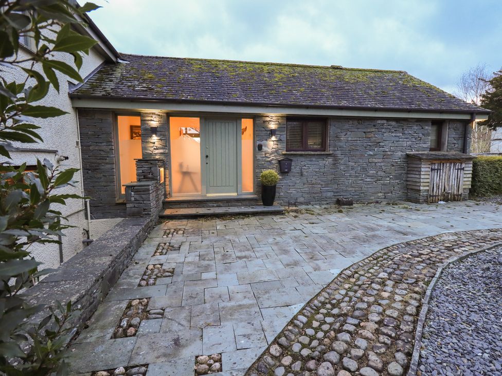 A building entrance with a front door and pathway at Haystacks in Troutbeck