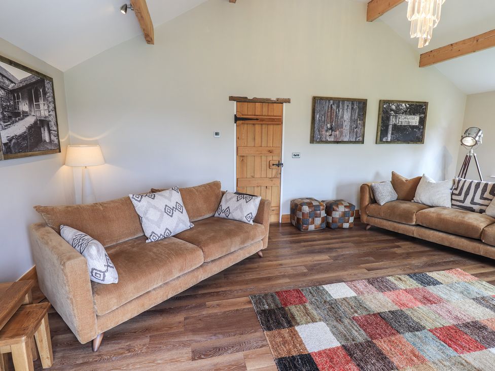 A living room with sofas and artwork at Haystacks in Troutbeck