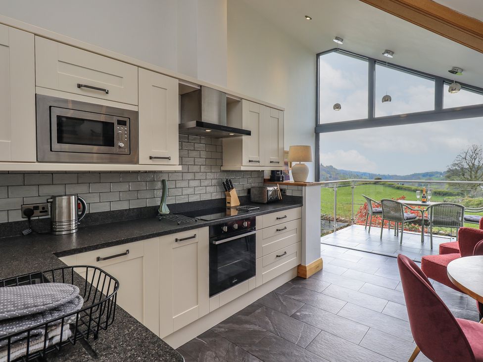 A kitchen with a view of the outdoors at Haystacks in Troutbeck