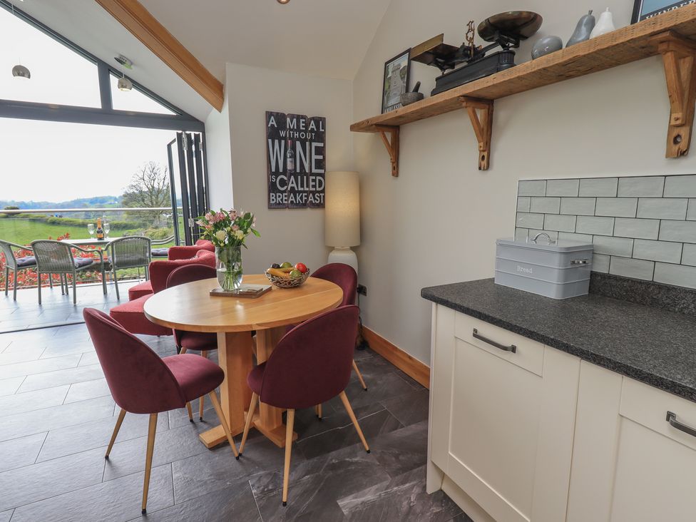A dining room with a table and chairs at Haystacks in Troutbeck