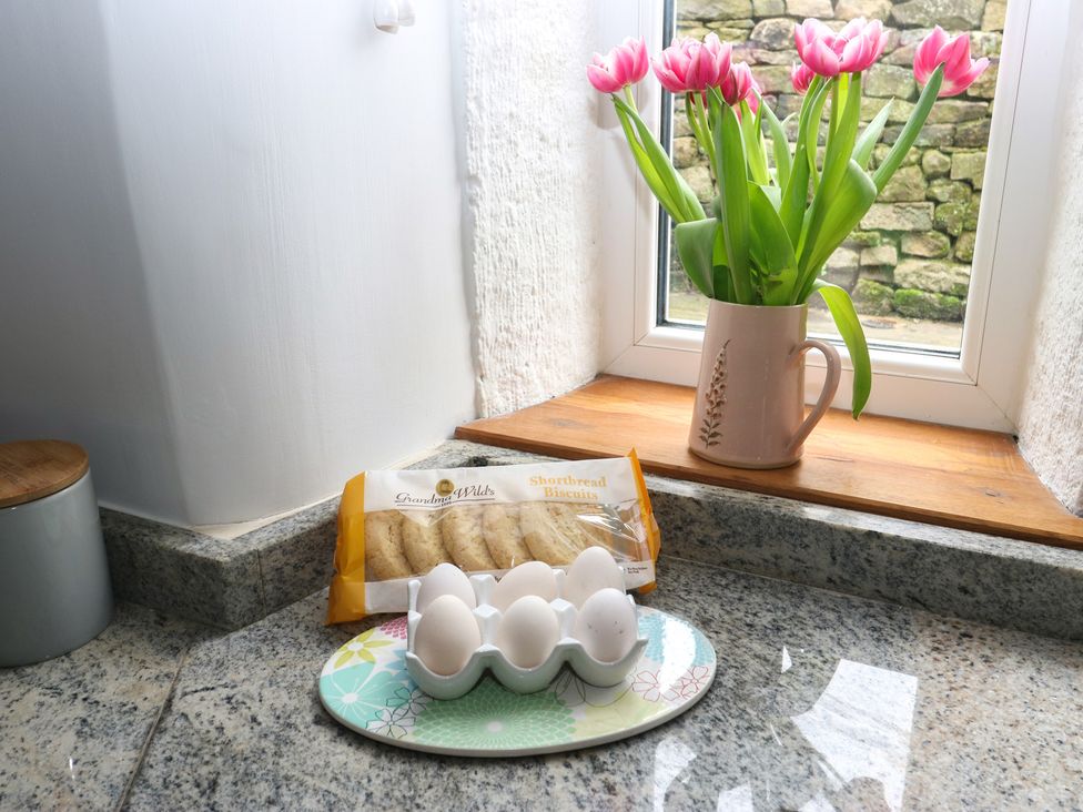 A kitchen counter with eggs and flowers at Barley Cote Farm in Riddlesden