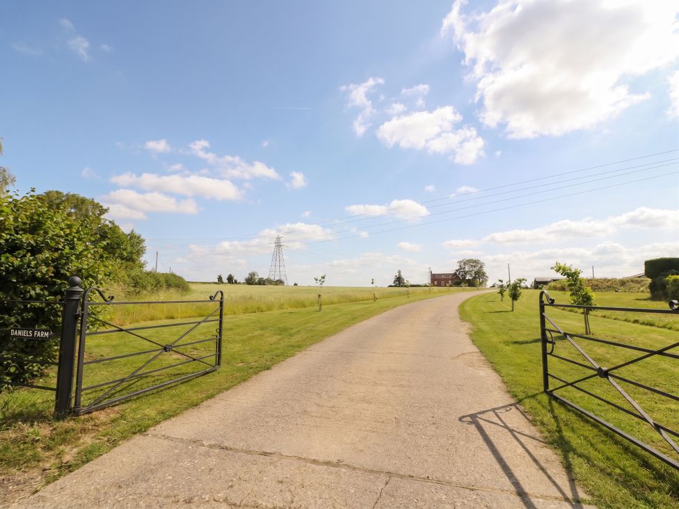 A driveway leading to a building at Daniels Farm in Claines
