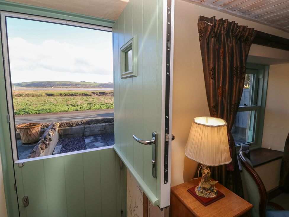 An entrance with a door open to a view at 2 Strand Cottages in Carmarthen
