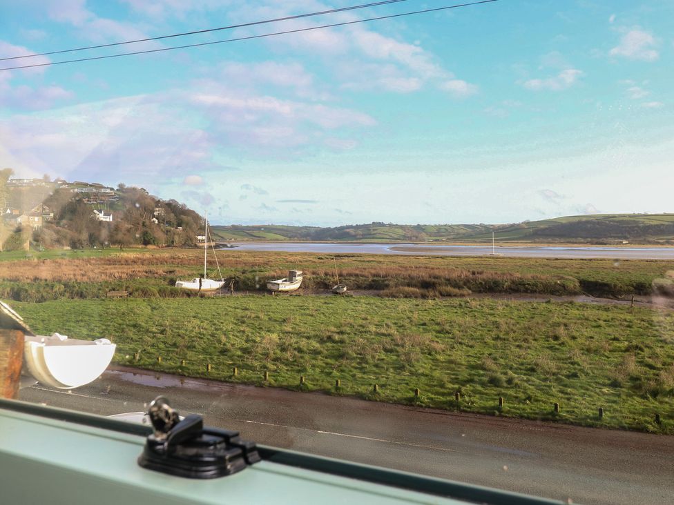 View of boats in water and grassland at 2 Strand Cottages in Carmarthen