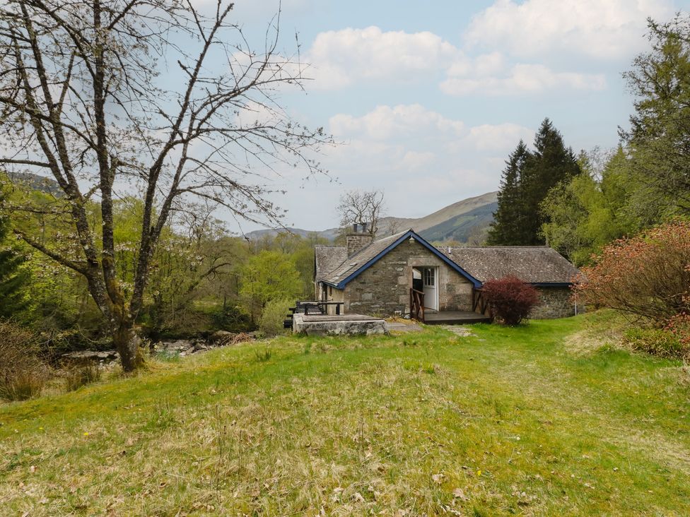 A house with a garden and trees at Culearn Mill in Balquhidder, Perthshire, Scotland