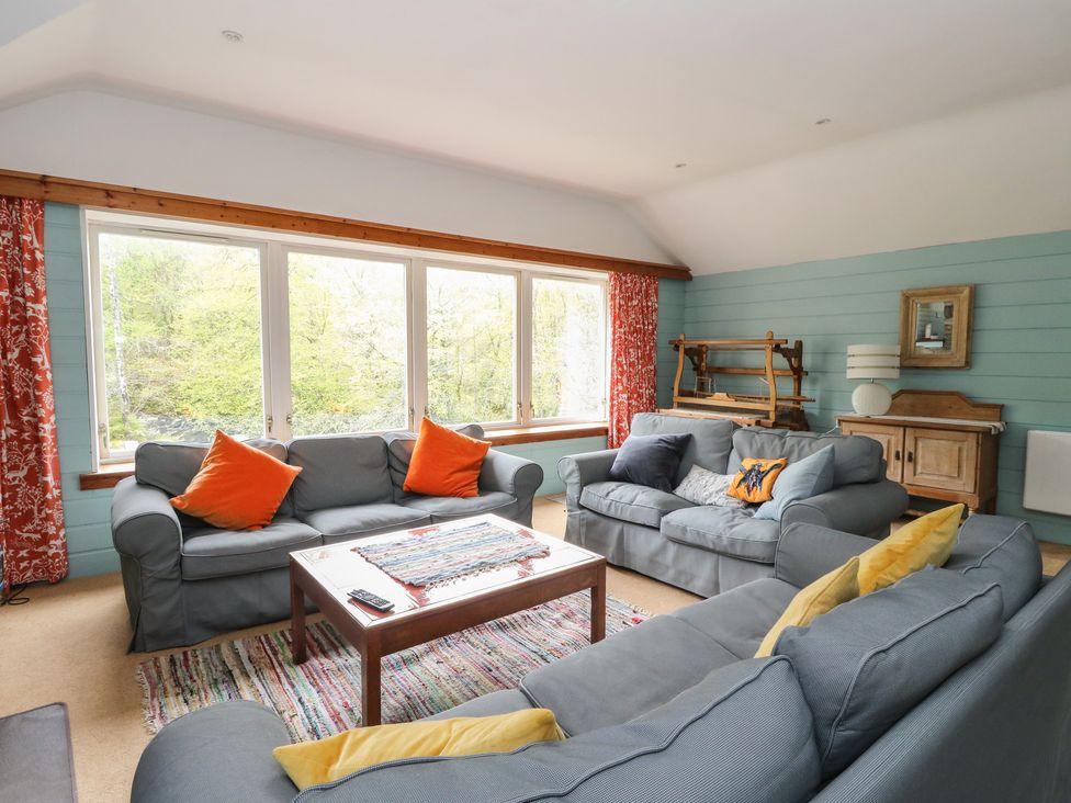 A living room with sofas and a coffee table at Culearn Mill, Balquhidder, Perthshire, Scotland