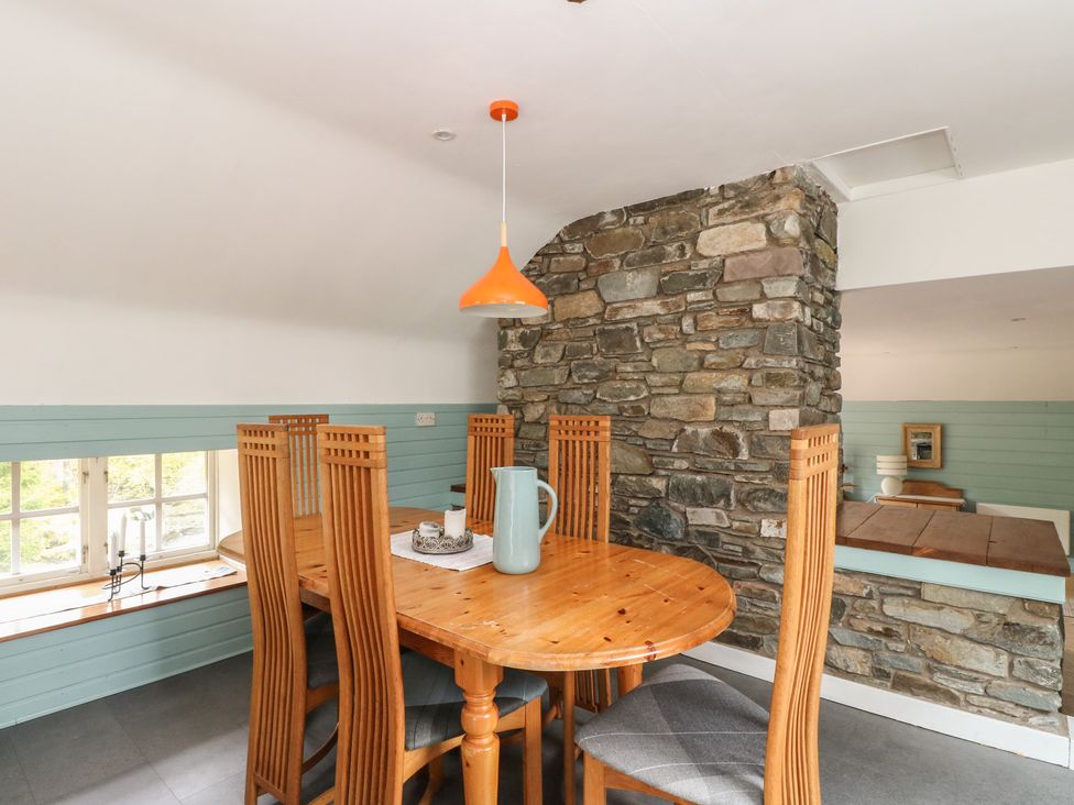 A dining room with a table and chairs at Culearn Mill, Balquhidder, Perthshire, Scotland