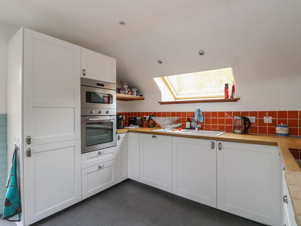 A kitchen with oven and sink at Culearn Mill in Balquhidder, Perthshire, Scotland