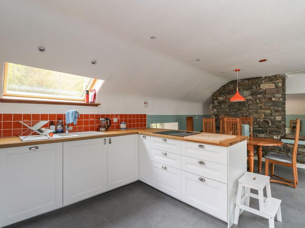 A kitchen with a sink and wood countertop at Culearn Mill Balquhidder, Perthshire, Scotland