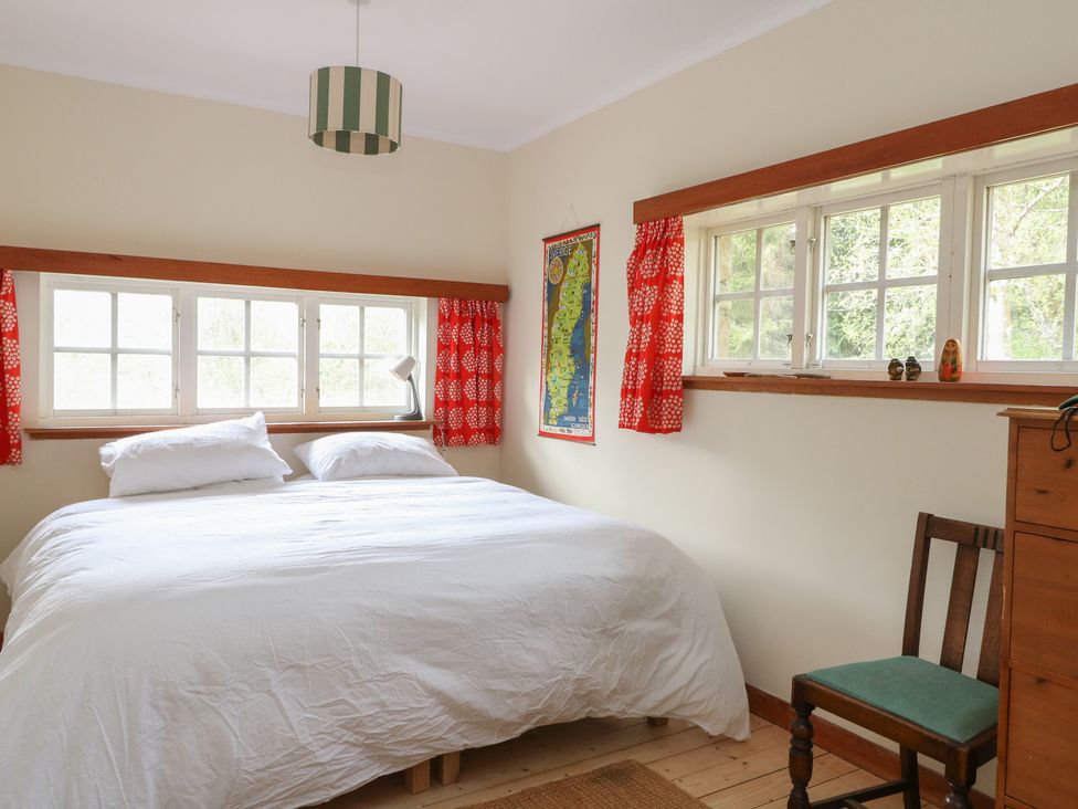 A bedroom with a bed and window at Culearn Mill Balquhidder, Perthshire, Scotland