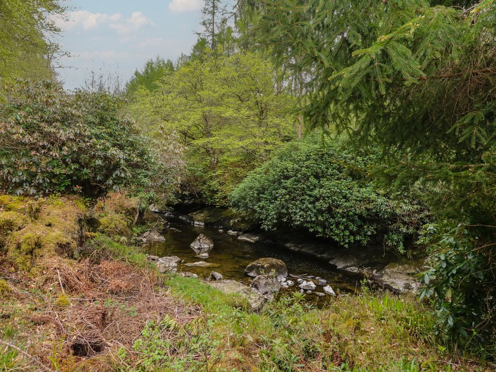 A stream with rocks and greenery at Culearn Mill, Balquhidder, Perthshire, Scotland