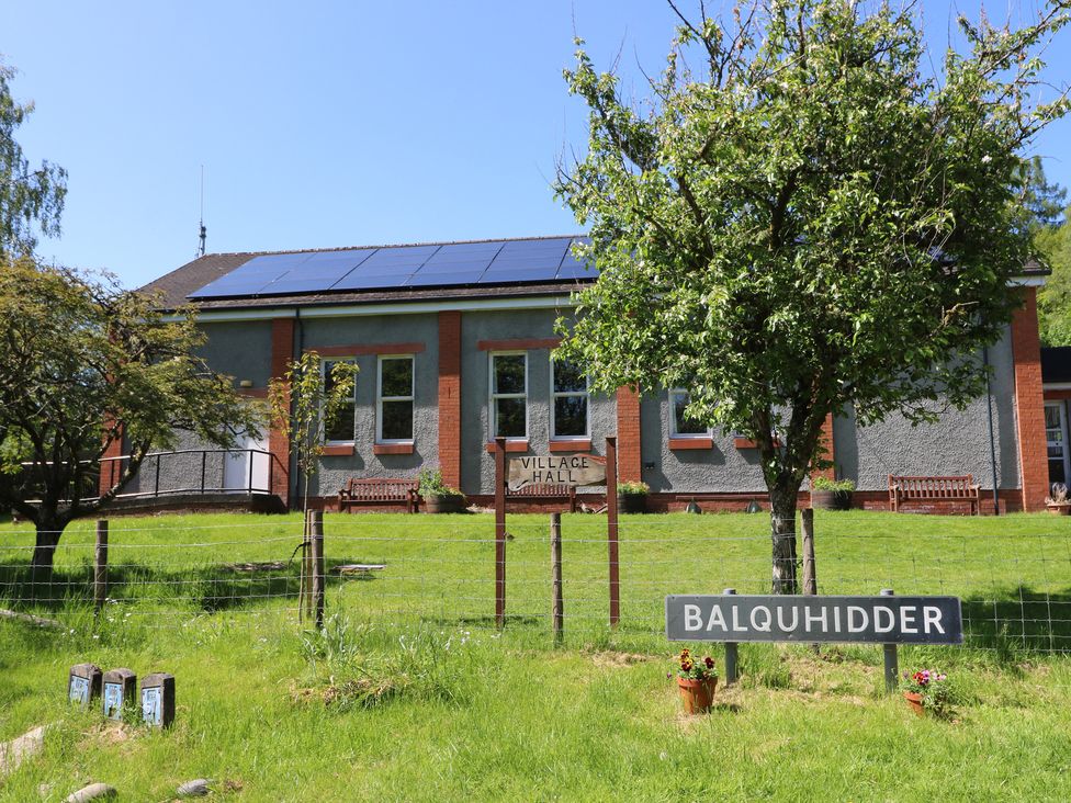 A village hall with a sign in front at Culearn Mill in Balquhidder, Perthshire, Scotland