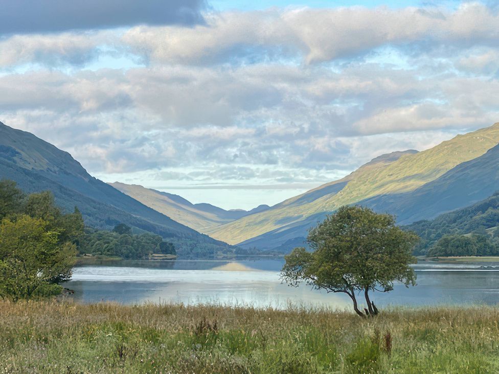 A scenic view of mountains and a lake at Culearn Mill, Balquhidder, Perthshire, Scotland