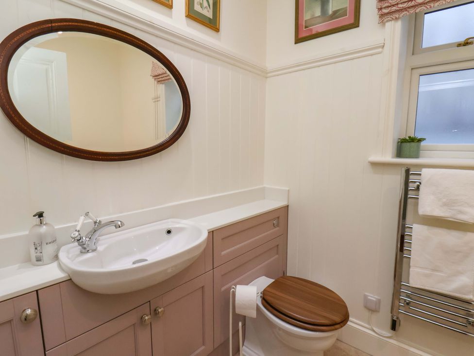 A bathroom with sink and toilet at Roding Cottage in Egton
