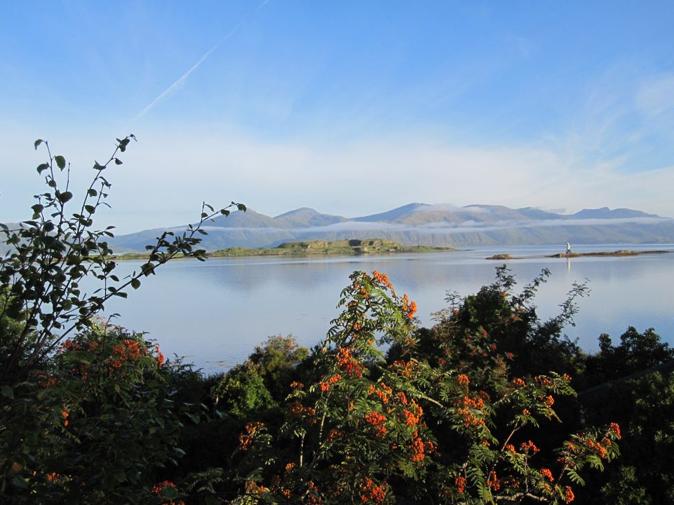 A landscape view of water and mountains at Tirlaggan Úr in Lismore