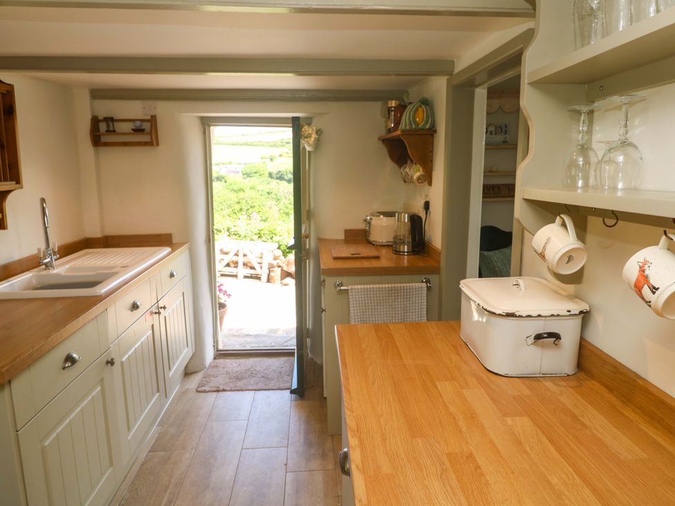 A kitchen with a sink and countertop at Greenways in Perranporth