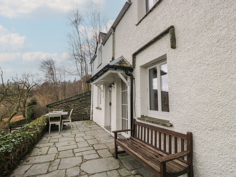 An outdoor area with a wooden bench and table at Brockstones in Grasmere