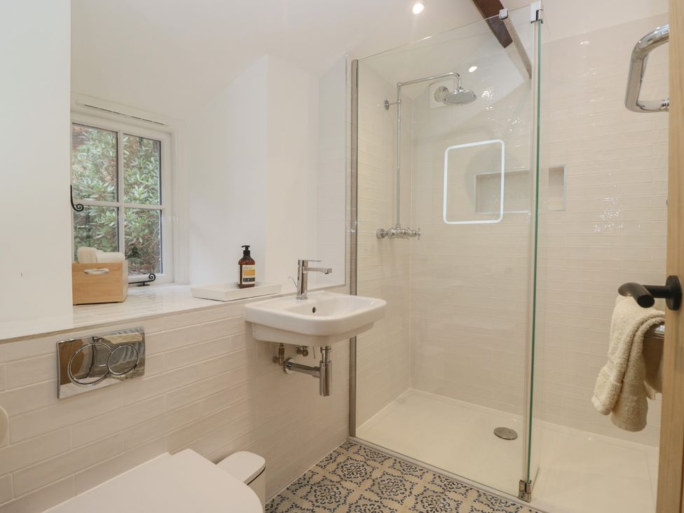 A bathroom with a shower and sink at Brockstones Grasmere