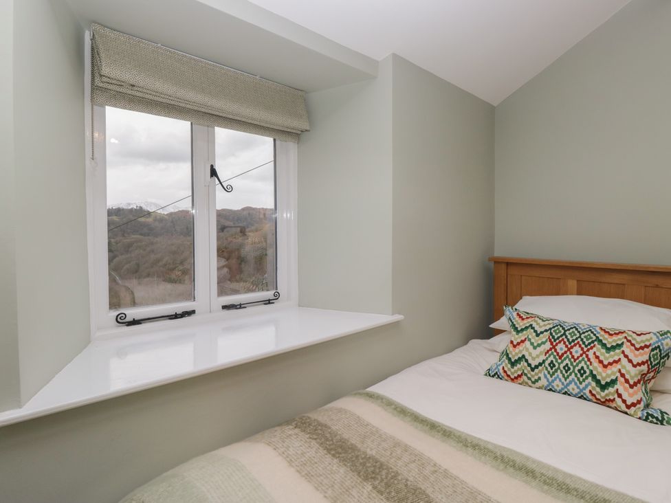 A bedroom with a bed and window at Brockstones Grasmere