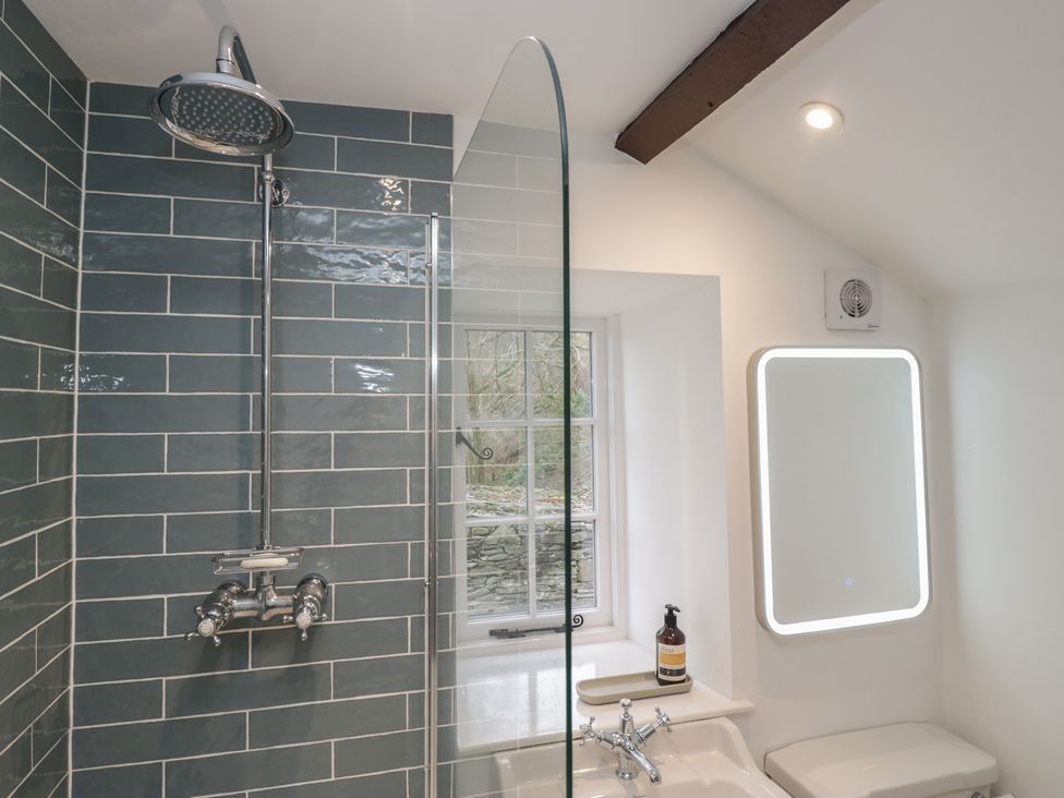 A bathroom with a shower and toilet at Brockstones in Grasmere