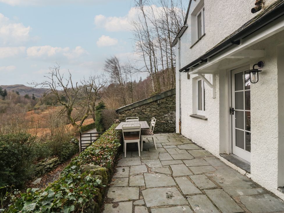 An outdoor area with a table and chairs at Brockstones in Grasmere