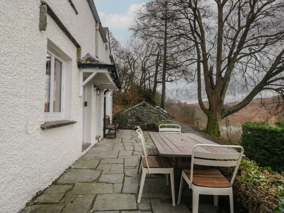 An outdoor area with a table and chairs at Brockstones in Grasmere