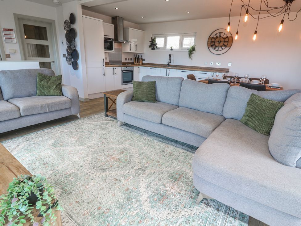 A living room with a sofa and coffee table at Bay View in Portreath