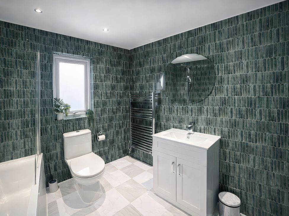 A bathroom with a sink and a shower in Bay View, Portreath