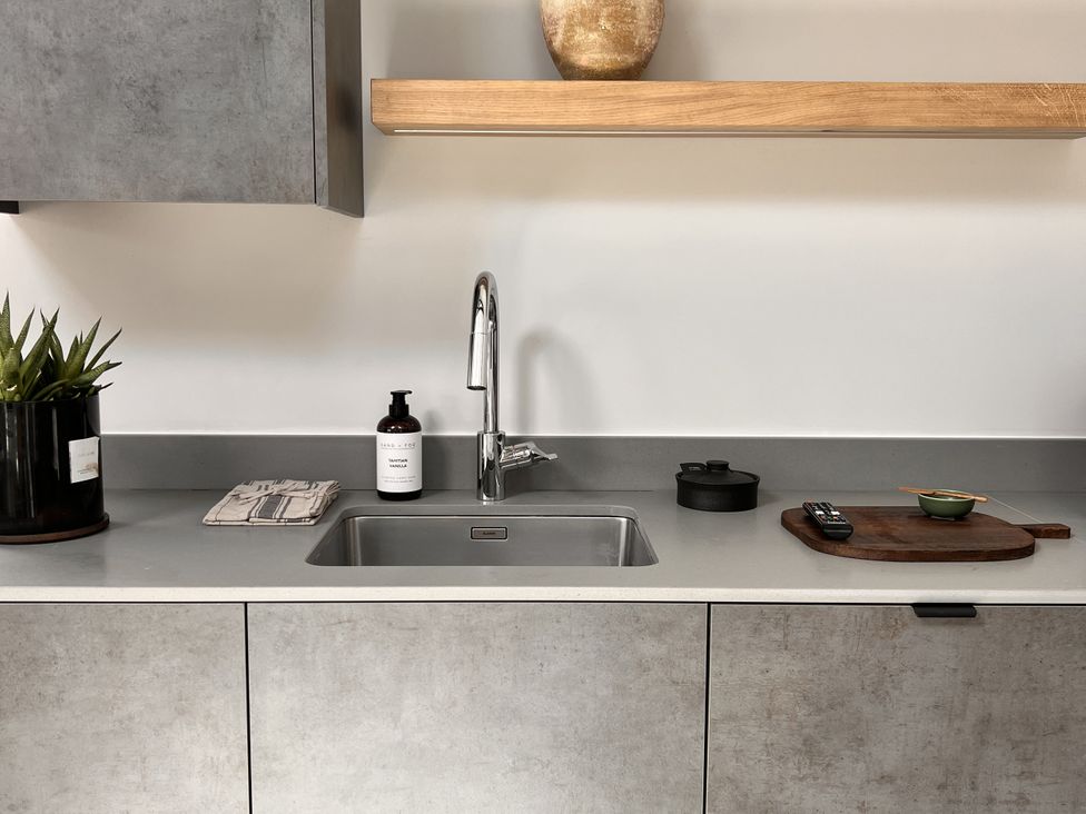 A kitchen with a sink and cabinet at Wabi in Gembling near Beeford