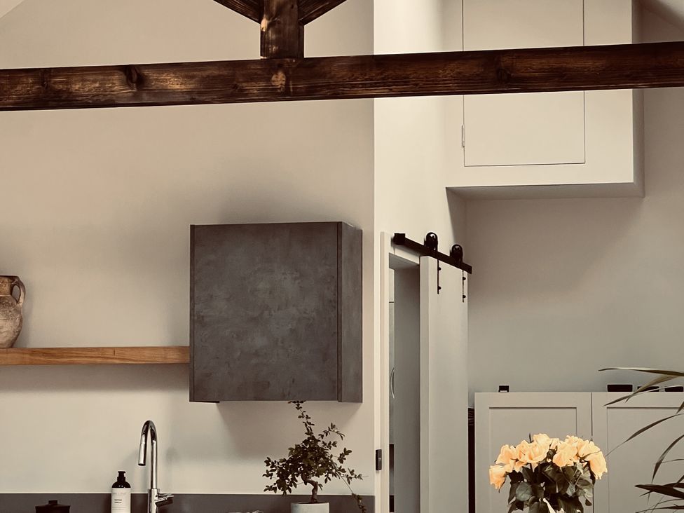 A kitchen with a cabinet and sink at Wabi in Gembling near Beeford