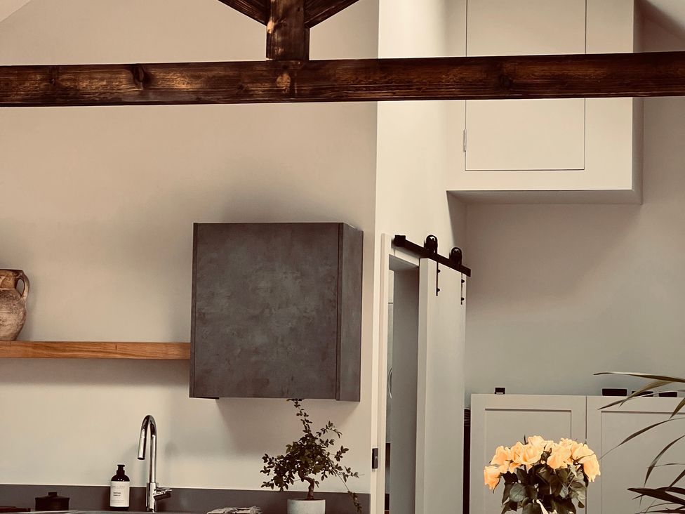 A kitchen with a sink and wall cabinet at Wabi Gembling near Beeford