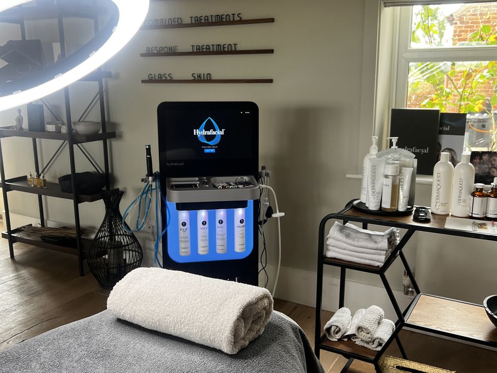 A treatment room with HydraFacial machine and towels at Sabi in Gembling near Beeford