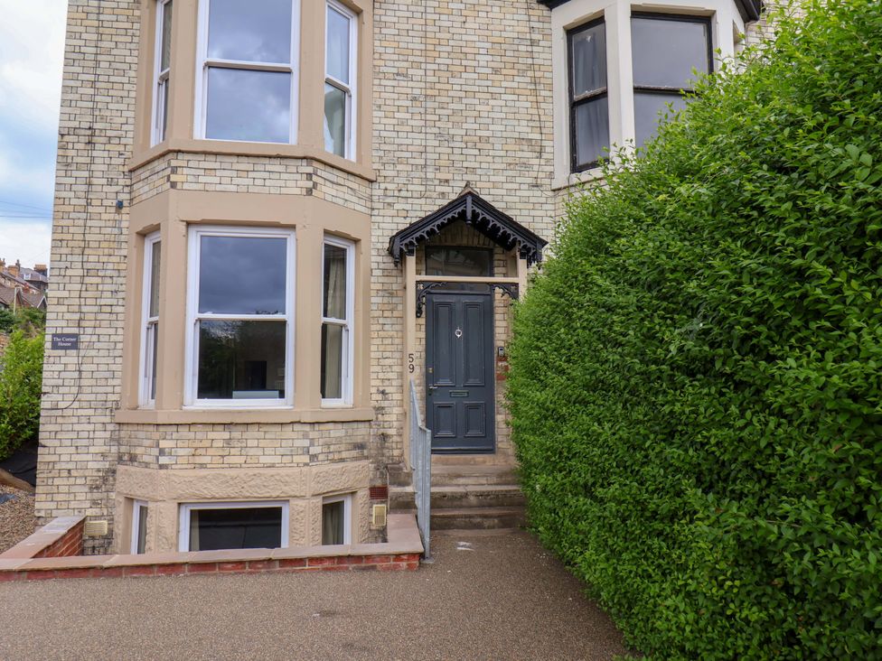 A house entrance with a front door and windows at The Corner House in Scarborough