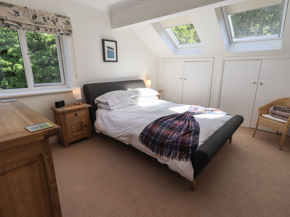 A bedroom with a bed and window at Waterfall in Ambleside