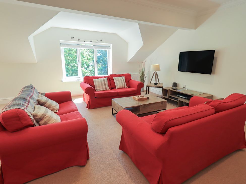 A living room with sofas and coffee table at Waterfall in Ambleside
