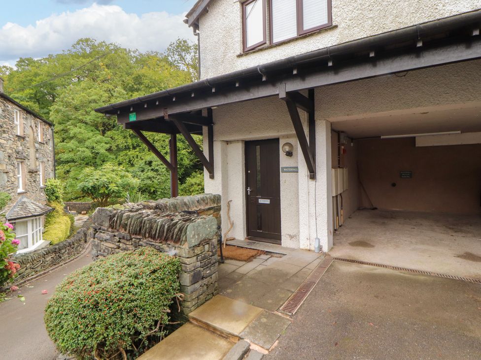 An entrance with a door and garage at Waterfall in Ambleside