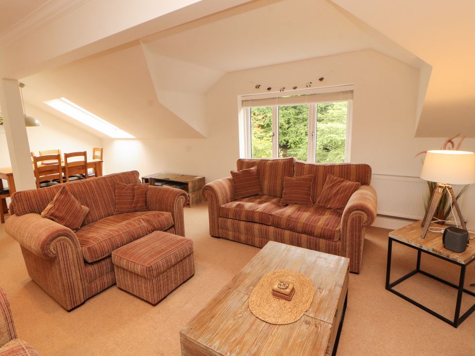 A living room with sofas and a coffee table at Waterfall in Ambleside
