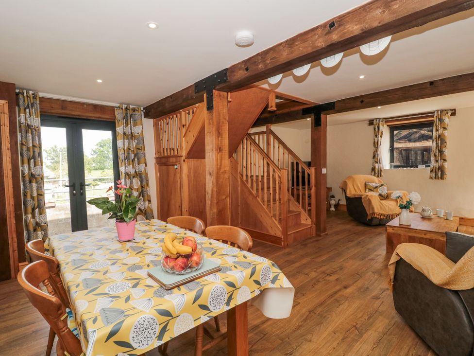 A dining room with a table and chairs at The Bull Pen in Yeovil, Somerset