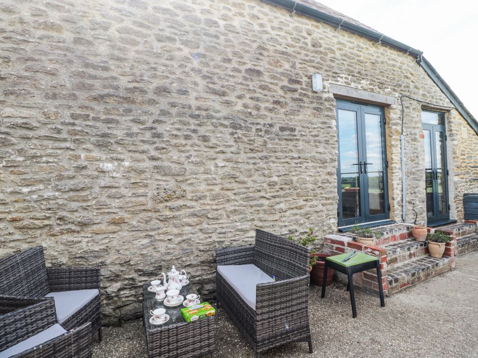 An outdoor area with seating and a coffee table at The Bull Pen Yeovil, Somerset