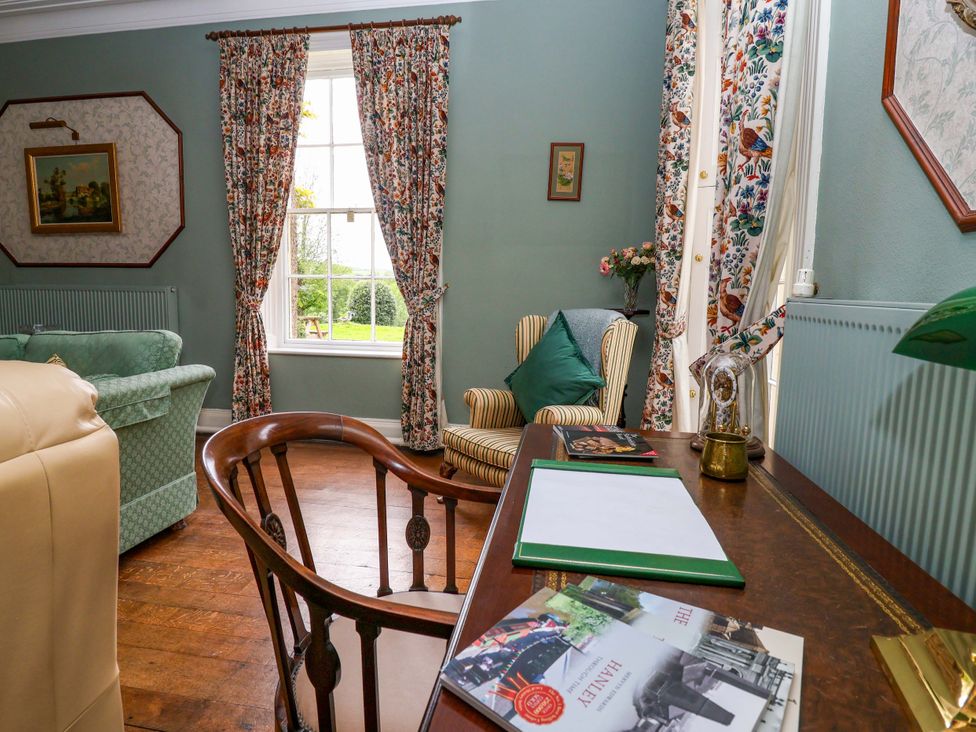A sitting room with a desk and chair at Parkfields House Tittensor near Barlaston