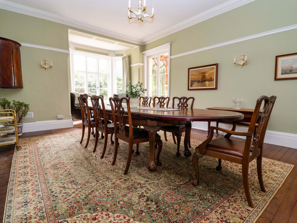 A dining room with a large table and chairs at Parkfields House Tittensor near Barlaston