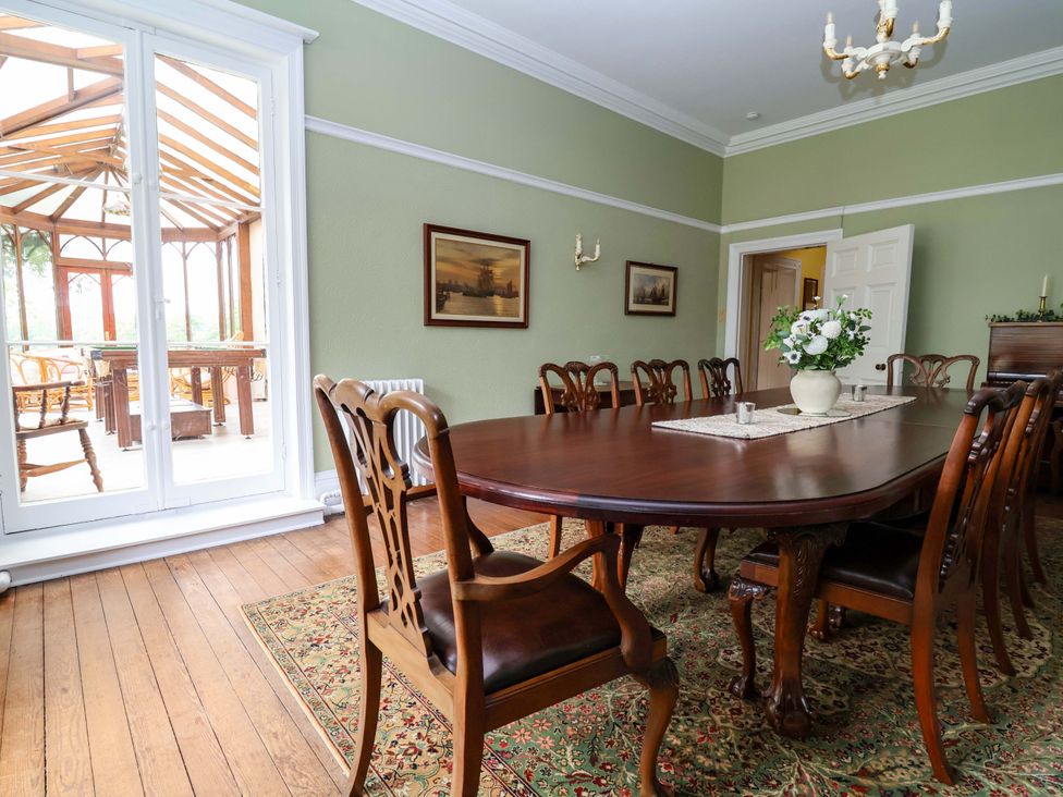 A dining room with a large table and chairs at Parkfields House Tittensor near Barlaston