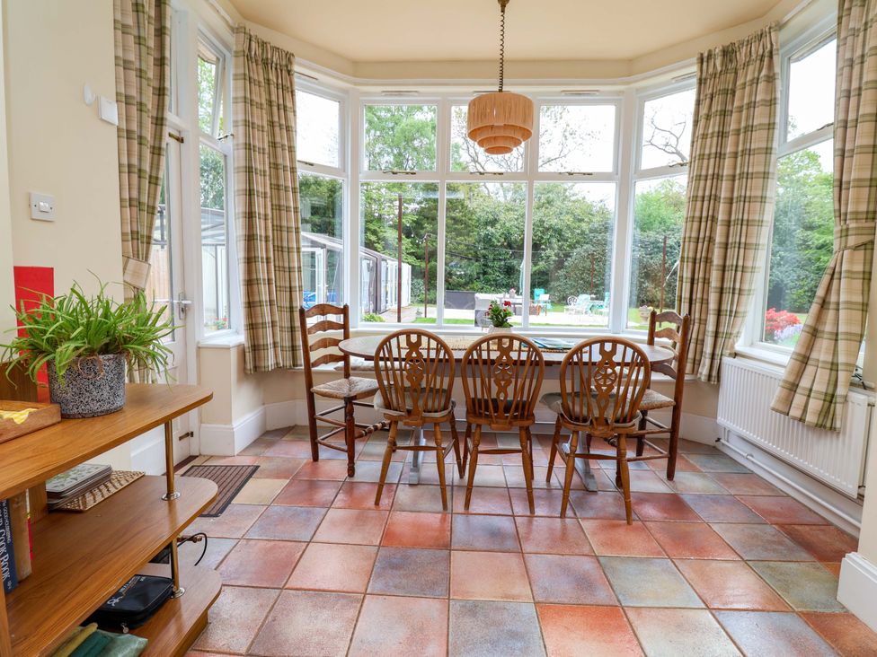 A dining room with a table and chairs at Parkfields House Tittensor near Barlaston