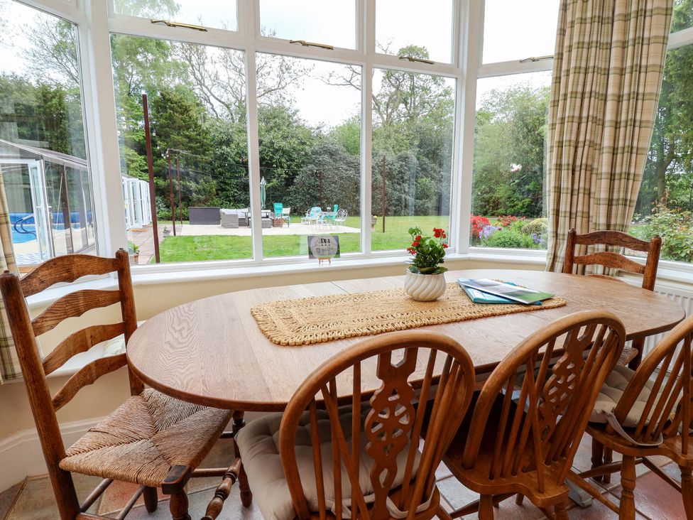 A dining room with a table and chairs at Parkfields House Tittensor near Barlaston